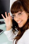 Smiling Businesswoman Holding Specs Stock Photo