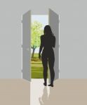 Woman In Open Door Stock Photo