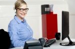 Woman Sitting In Front Of Computer Stock Photo