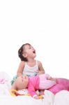 Little Girl Sitting With Dolls Stock Photo