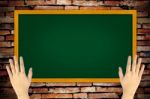 Hand Holding Green Blackboard Stock Photo