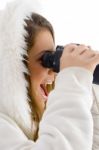 Happy Female Using Binocular To Watch Stock Photo