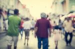 Blurred People Walking On The Street Of Old Town Stock Photo