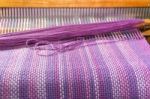 Detail Of Fabric In Comb Loom With Ultraviolet And Lilac Colors Stock Photo