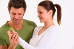 Couple Holding Leaf Stock Photo