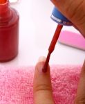 Woman Applying Nail Polish Stock Photo