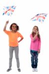 Girls Waving United Kingdom Flags Stock Photo