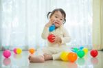 Little Asian Girl In Home Stock Photo