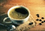 Vintage Coffee Cup With Bean On Table Stock Photo