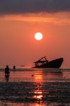 Wreck Boat ,sun Rising Sky And Photographer At Phuket Thailand Stock Photo