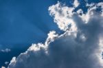 Sun's Rays Behind The Cloud Stock Photo