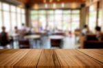 Selected Focus Empty Brown Wooden Table And Coffee Shop Or Resta Stock Photo