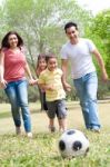 Family Playing Football Stock Photo