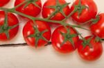 Fresh Cherry Tomatoes On A Cluster Stock Photo