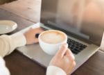 Woman Working With Laptop And Hot Coffee Stock Photo