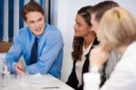 Partners At Workplace Discussing An Idea Stock Photo