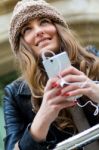 Young Woman Shopping In The City With His Mobile Phone Stock Photo