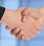 Handshaking Business People Stock Photo