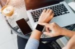 Woman Using Smart Watch In Coffee Shop, Modern City Lifestyle Stock Photo