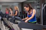 Woman Running On Treadmill Stock Photo