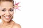 Beautiful Smiling Woman With A Lily Stock Photo