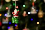 Santa Over Green Tree Ornament Hanging On Christmas Tree Stock Photo