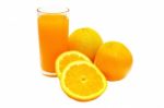 Orange Juice And Oranges Stock Photo