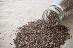 Chia Seeds Spilled Out Of Bottle Stock Photo