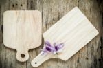 Wooden Chopping Board On Old Wooden Table. Top View Stock Photo