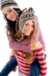 Young Girl Giving Piggyback To Her Friend Stock Photo