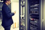 Man Fix Server Network In Data Center Room Stock Photo