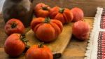 Freshly Picked Tomatoes, Place On Wooden Chopping Board And Table Stock Photo