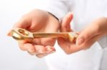 Hands With A Gold Key Stock Photo