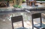 Empty Wooden Table And Chair In Local Restaurant Stock Photo