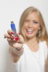 Smiling Woman With Usb Memory Stick In Hands Stock Photo