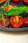 Baked Cherry Tomatoes With Basil And Thyme Stock Photo