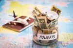 Holidays Budget Concept With Compass, Passport And Aircraft Toy Stock Photo