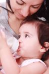 Baby Drinking Milk From Bottle Stock Photo