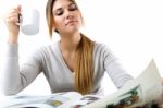 Young Beautiful Girl Reading News And Drinking Coffee. Isolated Stock Photo