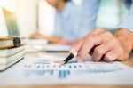 Business Team Hands At Working With Plan On Office Desk And Mode Stock Photo