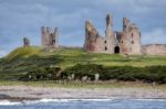 Craster, Northumberland/uk - August 18 : View Of Dunstanburgh Ca Stock Photo