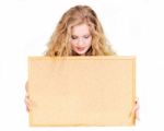 Woman Looking At Cork Board Stock Photo