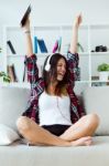 Beautiful Young Woman Listening To Music At Home Stock Photo