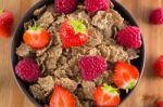 Bran Flakes With Fresh Raspberries And Strawberries Stock Photo