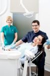 Female Patient With Dentist And Assistant Stock Photo