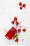 Strawberry Smoothie In Mason Jar With Straw Stock Photo