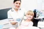 Professional Dentist Posing With Girl Child Stock Photo