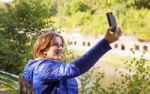 Young Girl Photographing Herself A Mobile Phone Stock Photo