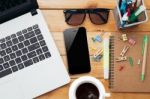 Workplace With Laptop Coffee Phone And Notebook On Wood Desk Stock Photo