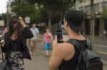 Man Photographing Girl On Street Stock Photo